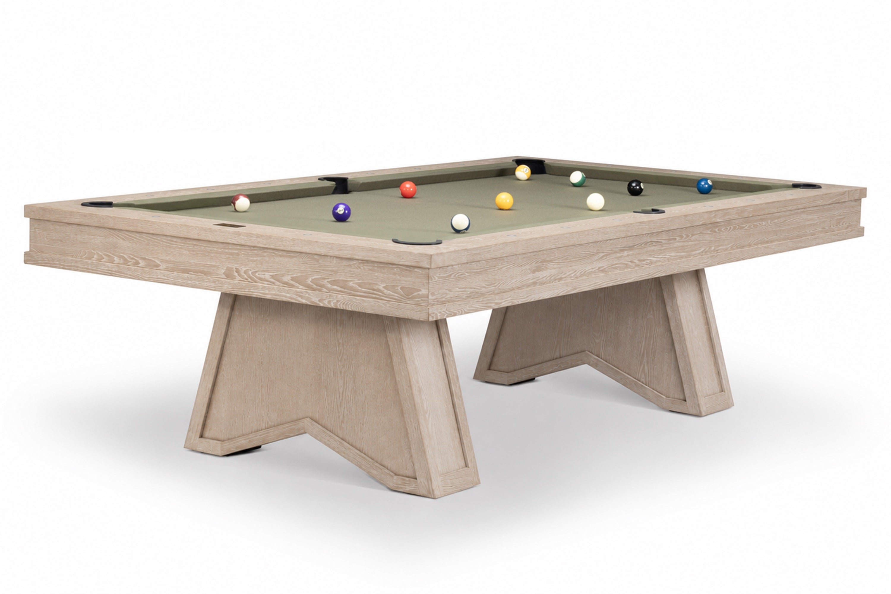 A modern pool table with a light beige wood-grain frame and legs, featuring a sage green felt surface with several colorful billiard balls, shown on a white background.