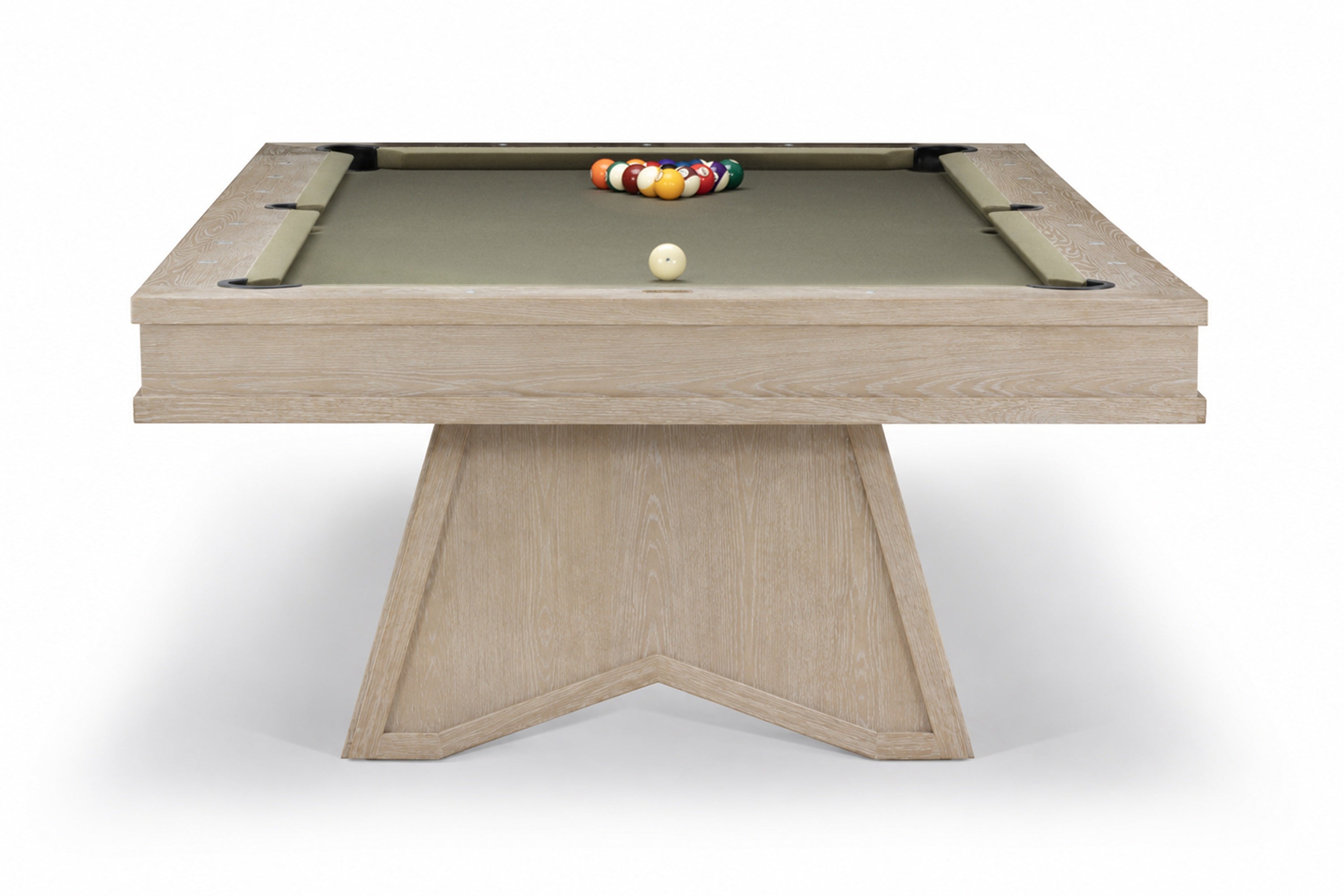 A modern pool table with a light oak wood frame and a green felt playing surface, featuring a geometric triangular base and racked billiard balls on a white background.