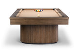A modern pool table with a dark brown wood-grain frame and a fluted cylindrical base, featuring tan felt pockets and a racked set of billiard balls on a white background.