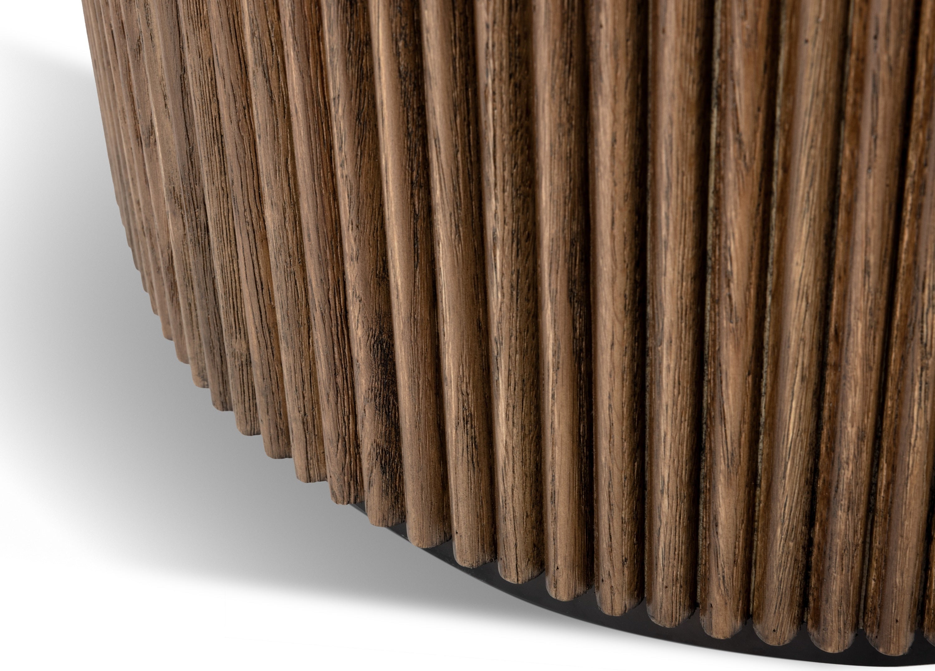 Close-up of a curved wooden slatted furniture piece, showing the natural wood grain and vertical rod pattern against a white background.