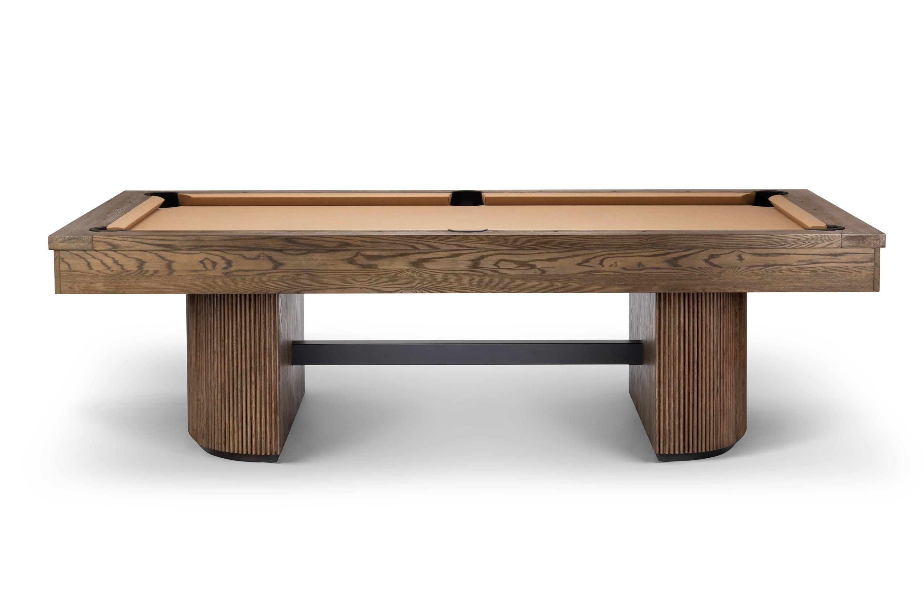 A modern pool table with a medium brown wood grain frame, a light tan felt playing surface, and chunky ribbed wooden legs, shown against a plain white background.