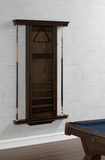 Wooden pool cue cabinet against a white brick wall with a pool table in the foreground.